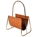 Brown leather magazine holder with gold metal frame on a white background by carl aubock