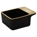 Black rectangular aubock dish with brass rim on a white background