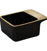 Black rectangular aubock dish with brass rim on a white background