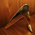 aubock 4630 brass bookend in side view on a wood table