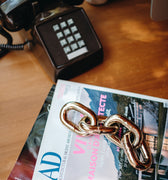 aubock chain on a table with vintage phone