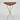 Wooden table with gold metal legs on a white background