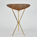 Wooden table with gold metal legs on a white background