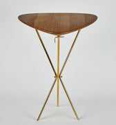Wooden table with gold metal legs on a white background