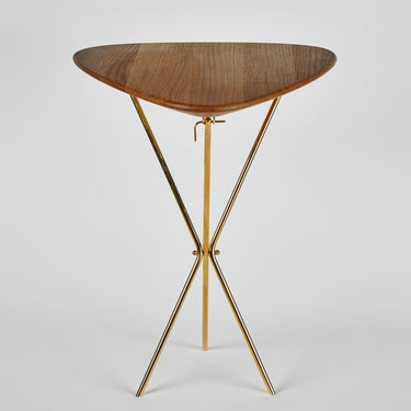 Wooden table with gold metal legs on a white background