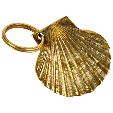 Gold scallop shell keychain on a white background