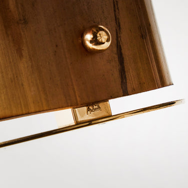 Close-up of a wooden bookend stamped aubock