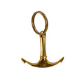 Gold anchor-shaped keychain on a white background