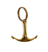 Gold anchor-shaped keychain on a white background