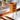 Wooden table lamp on a windowsill with a blurred natural background