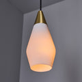 Two glass pendant lights similar to tynell or mauri almari with brass accents on a grey background detail of shade