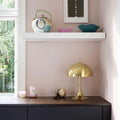 panthella_320_brass_ss21_interior_2_2_07244_master.jpeg