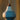 Modern cirque ceramic pendant light with a white and blue design against a blurred background 'Cirque' Pendant Lamp by Clara von Zweigbergk for Louis Poulsen Two enlighten