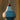 Modern cirque ceramic pendant light with a white and blue design against a blurred background