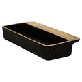 Black rectangular dish with brass handle on a white background