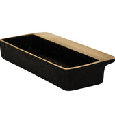 Black rectangular dish with brass handle on a white background