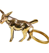 Gold donkey-shaped keychain on a white background