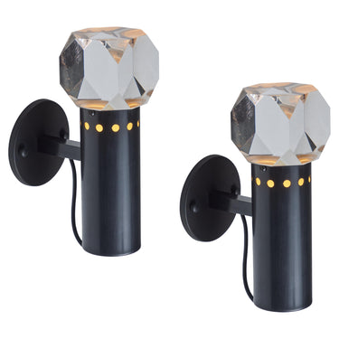 Two black wall-mounted lights with crystal-like tops on a white background