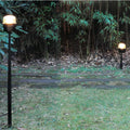 Joe Columbo Fresnel Bollard in garden Oluce Two Enlighten
