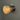 chrome fresnel light three quarter view against a grey wall lit up