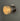 chrome fresnel light three quarter view against a grey wall lit up