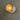 Light fixture with a white base against a gray background