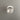 Oluce round colombo fresnel wall light fixture on a gray wall