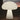Mushroom-shaped lamp glowing in a dark outdoor setting