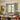 midcentury Tratten conical pendant over a midcentury dining table 