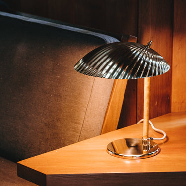 tynell 5321 gubi lamp on warm wood table