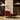 Red armchair in a room with patterned screen and tynell lamps