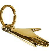 Brass hand keychain on a white background