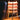 Wooden lamp with a warm glow on a wooden surface.