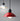 Red pendant light with a black base on a gray background