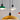 Colorful pendant lights hanging against a plain background