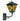 Vintage-style outdoor wall light with green patina and amber glass on a white background