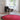 large round aros rug with miguel mila lamp and gio ponti chair in white room