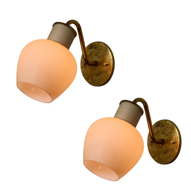 Pair of vintage 1950s Vilhelm Lauritzen brass and glass 'Christiansborg' sconces for Louis Poulsen on white background lit