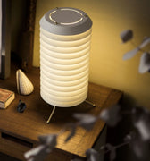 Table lamp with ribbed design on a wooden surface