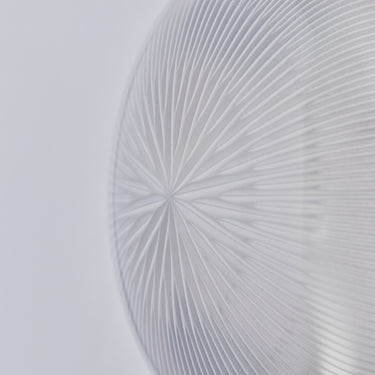 Close-up of a textured glass design on a light gray background