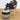 Person sitting on a chair with a striped ottoman in front