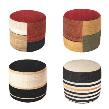 four colorful pouf ottomans in warm colors and black and white on white background
