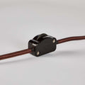 cord switch with brown cable on a light gray background