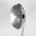 Modern floor lamp with metallic design on a white background