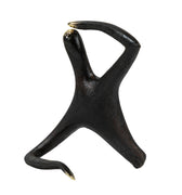 Black abstract sculpture on a white background