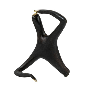 Black abstract sculpture on a white background