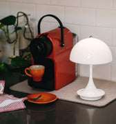 two-enlighten-portable-lamps-panthella 160 opal white on a kitchen counter