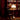 Home library filled with books in a dimly lit room with a 70s white floor lamp.
