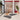 Modern interior design with circular rugs, a red sofa, and a staircase.