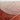 Glass coffee table with metal legs on a red textured surface